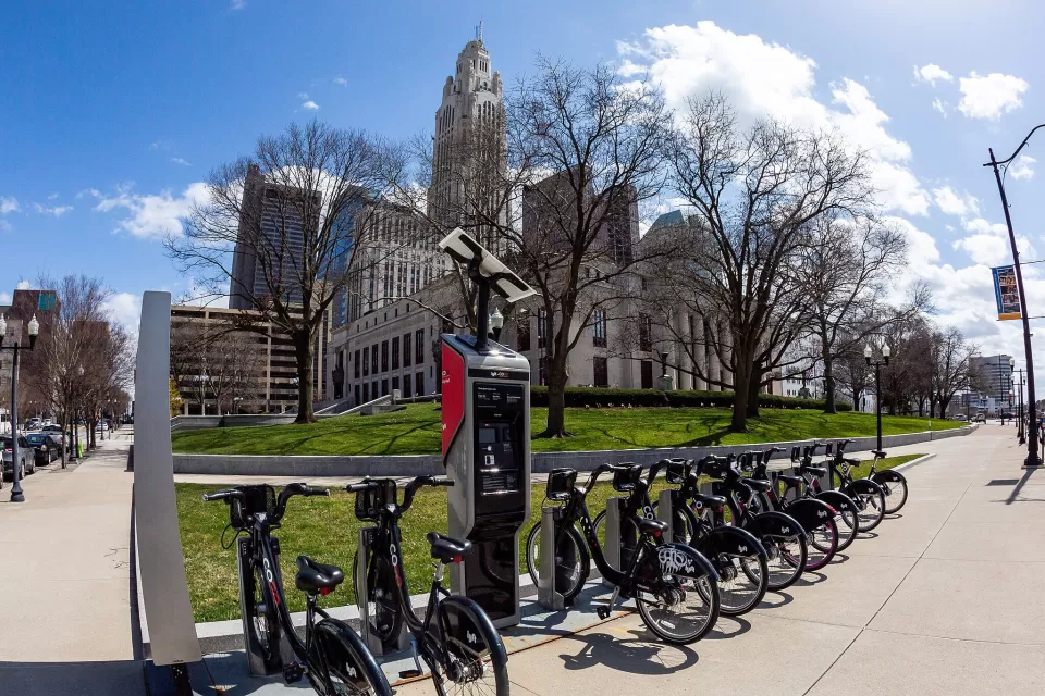 CoGo bike share station with black bikes in front of Columbus City Hall, Ohio